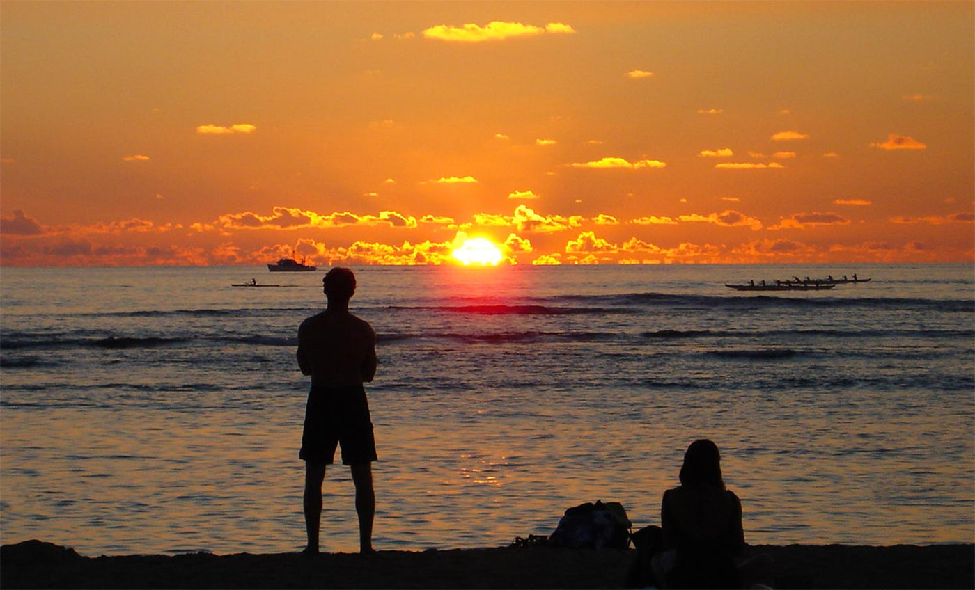 canoe paddlers at sunset in Waikiki